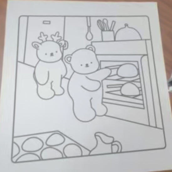 Sped up montage of coloring a black and white page featuring a reindeer and a bear indoors baking breads in an oven.